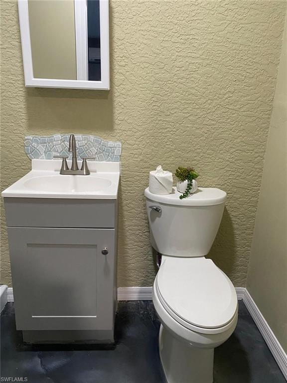 Bathroom with vanity and toilet