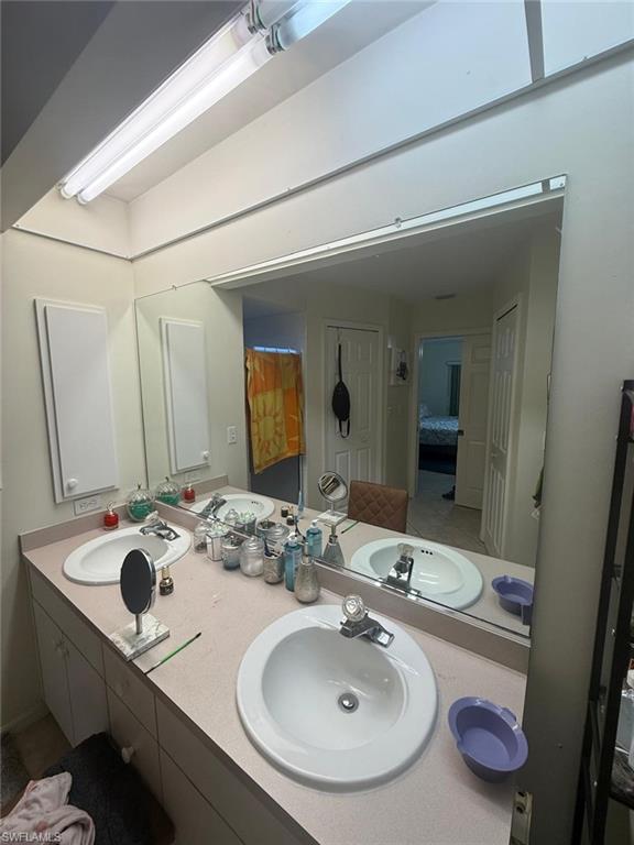 Bathroom with vanity and tile patterned flooring