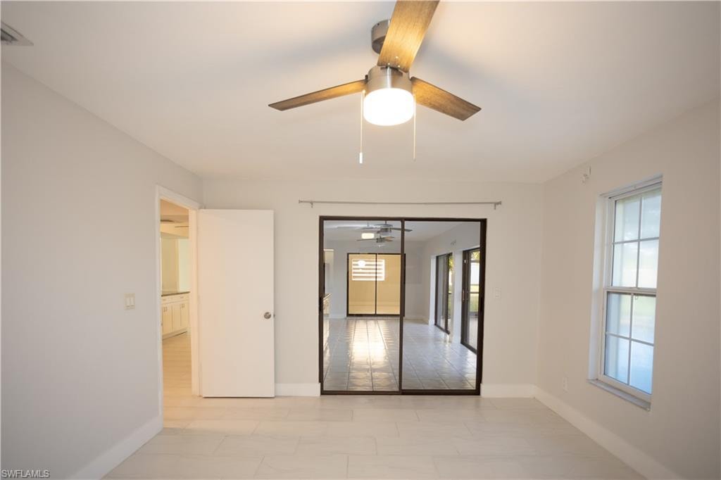 Unfurnished room featuring ceiling fan