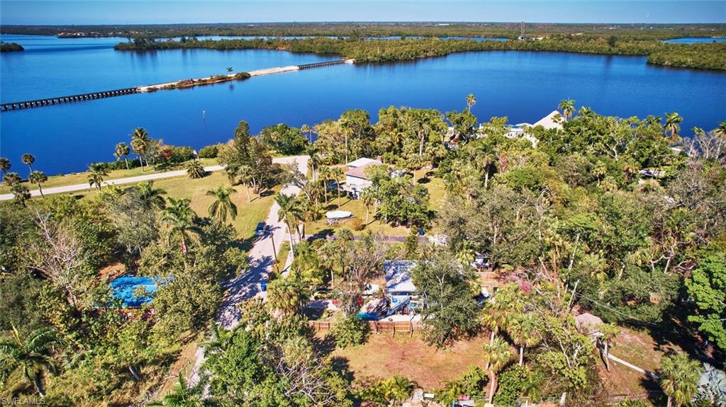 Drone / aerial view featuring a water view and lot