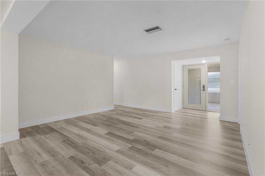Spare room featuring light wood-type flooring
