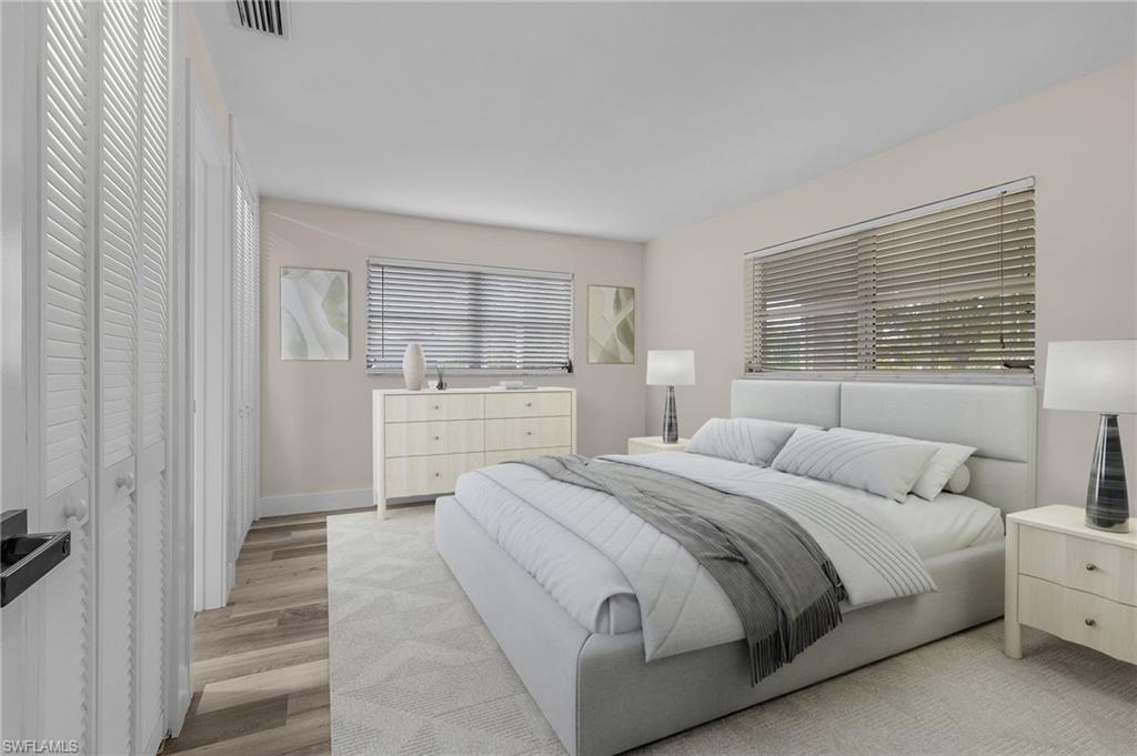 Bedroom with light hardwood / wood-style flooring