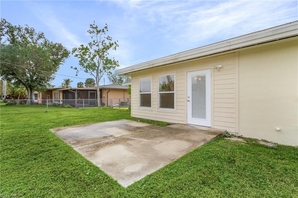 View of fenced yard with a patio