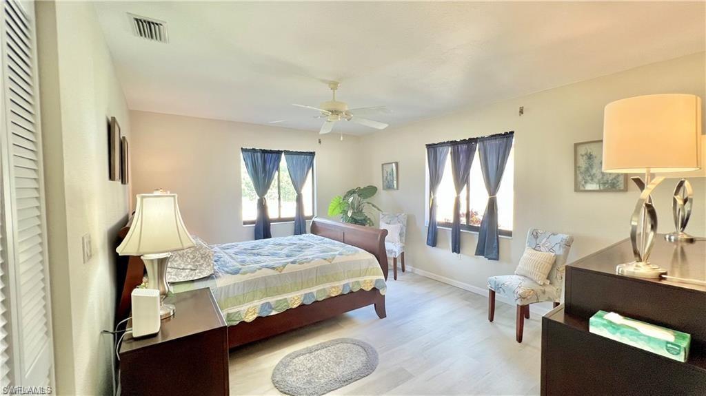 Bedroom featuring ceiling fan and light hardwood / wood-style flooring