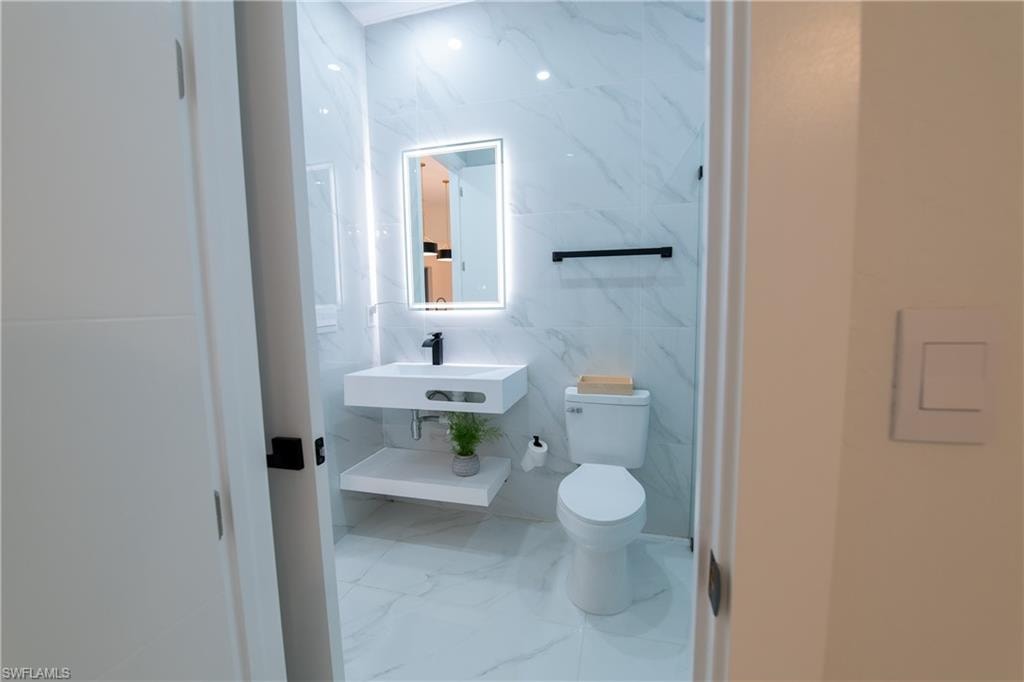 Bathroom with sink and toilet