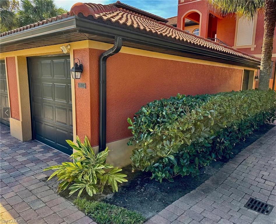 View of property exterior featuring  garage