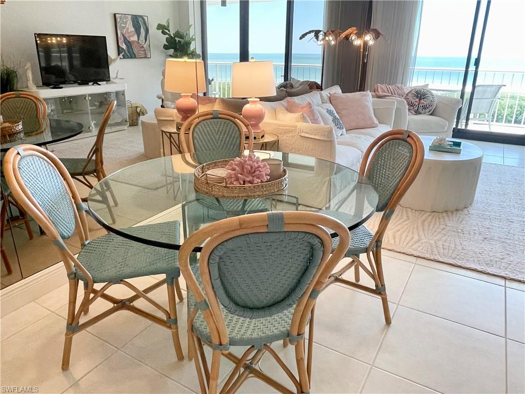 Tiled dining area with a water view