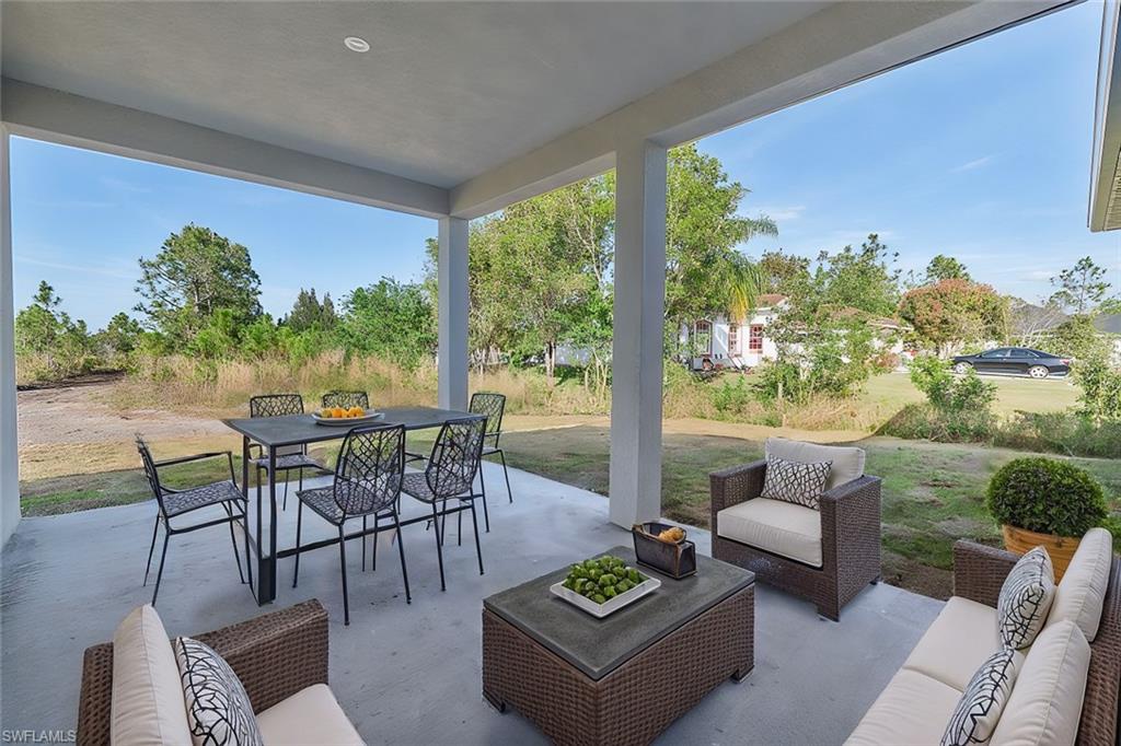 View of patio featuring outdoor dining area and an outdoor living space