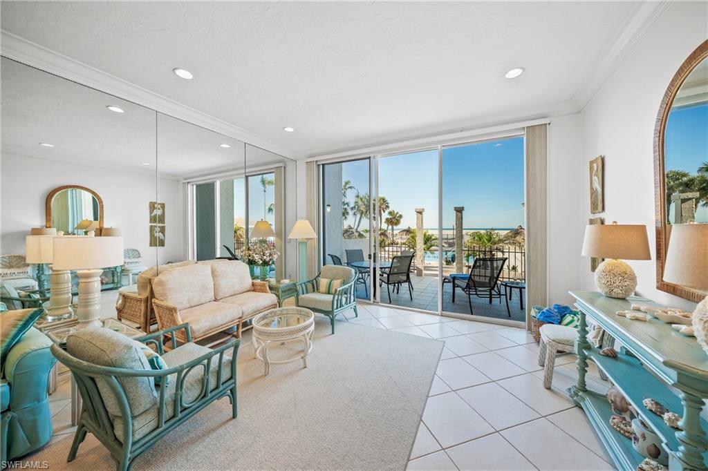 Living room with expansive sliders leading to elevated porch