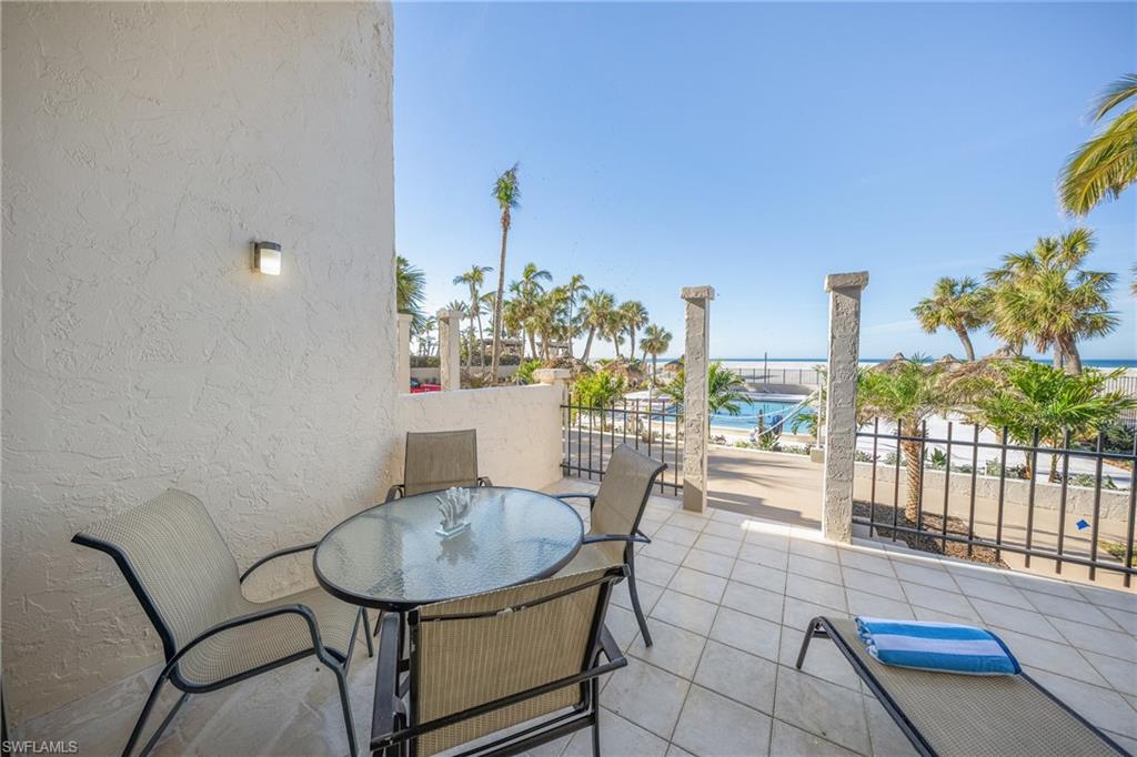 View of patio / terrace with a water view