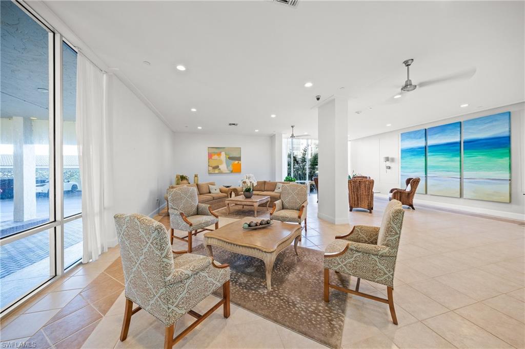 Lobby entrance to the first-floor management office, fitness, mailboxes and elevators to other units. The two beachfront units on the first floor are across the covered driveways and adjacent condo storage.