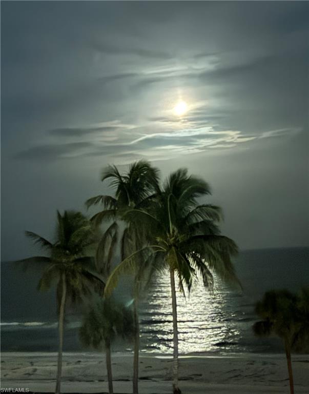 Property view overlooking moonlit beac