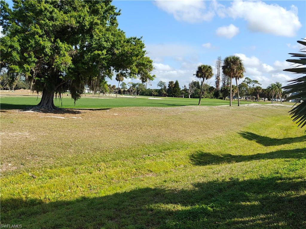 Surrounding community featuring a lawn