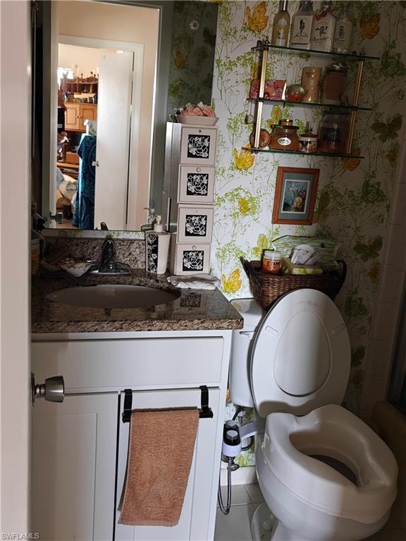Bathroom with vanity and toilet