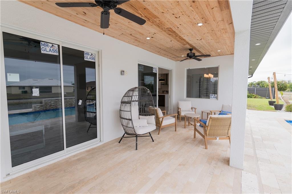 View of patio featuring ceiling fan and outdoor seating