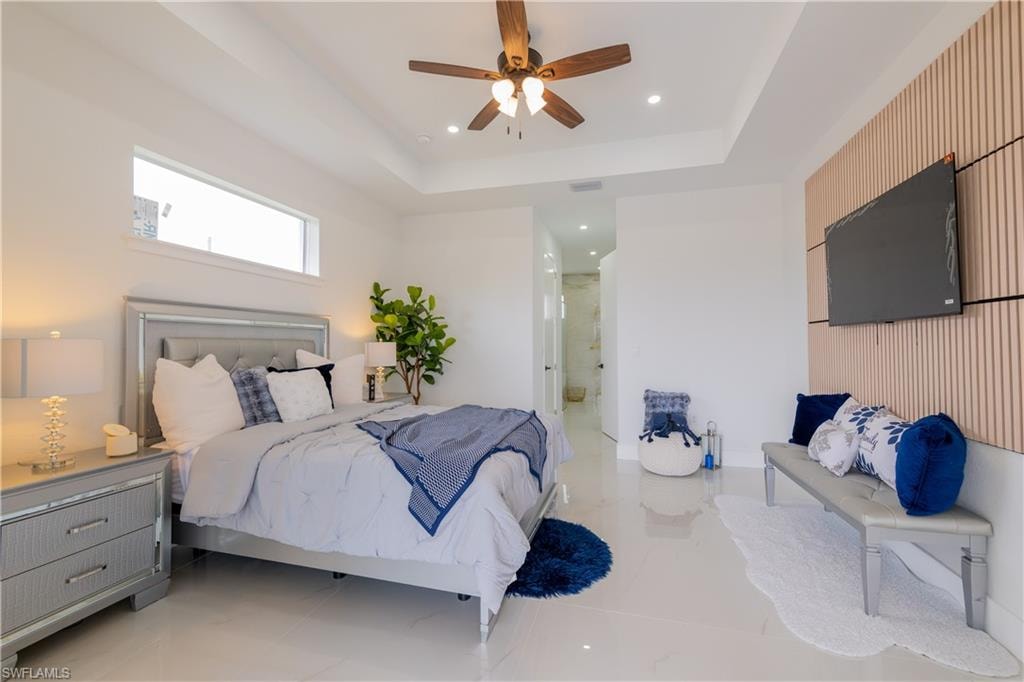 Bedroom featuring a ceiling fan, recessed lighting, and light tile patterned flooring