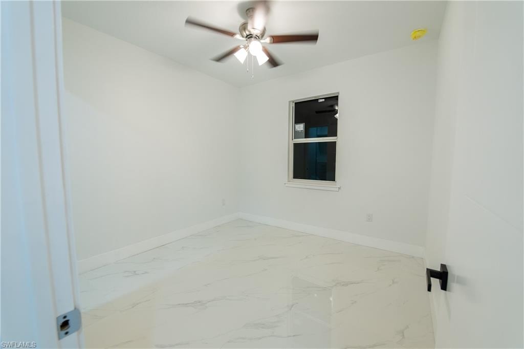 Unfurnished room with ceiling fan