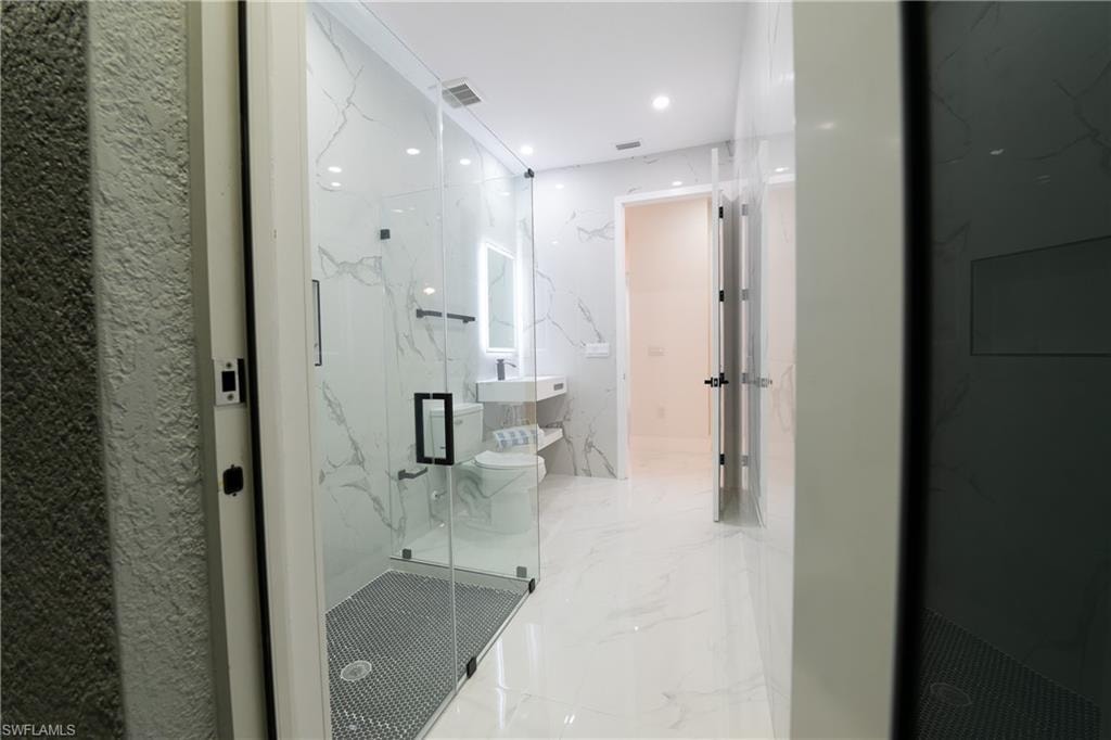 Bathroom with an enclosed shower
