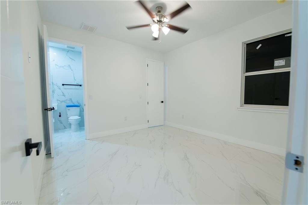 Spare room featuring ceiling fan