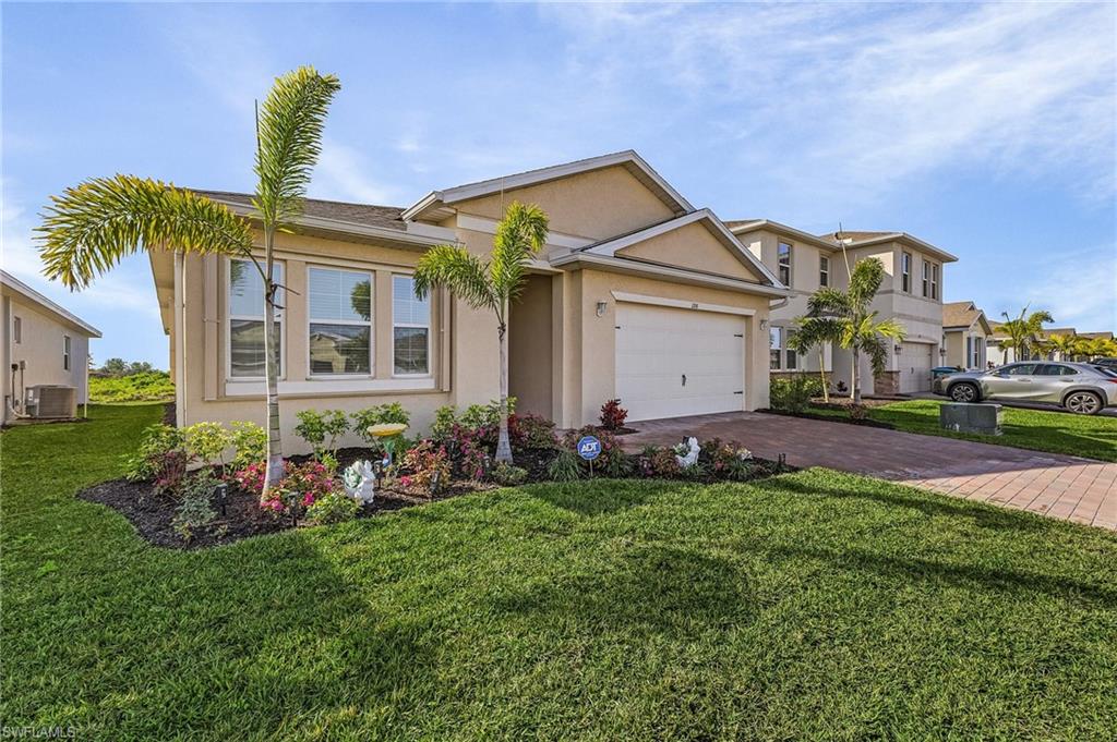 Single story home featuring a front lawn and central air condition unit