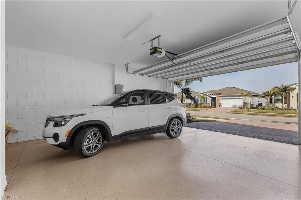 Garage featuring a garage door opener