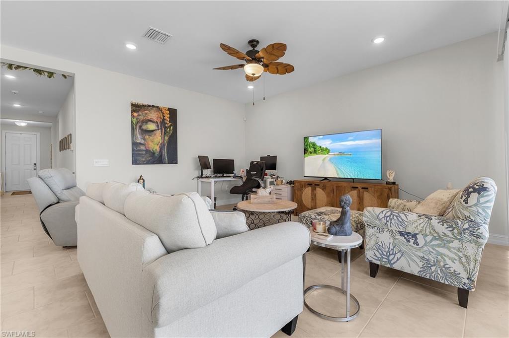Tiled living room with ceiling fan