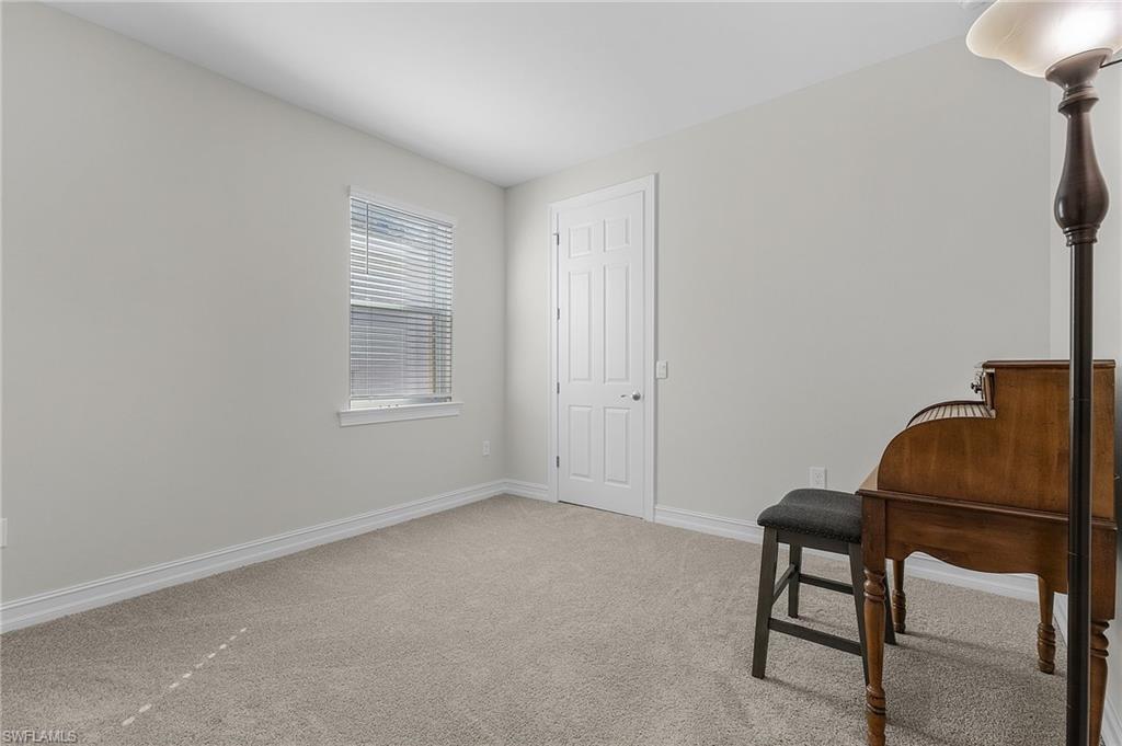 Sitting room featuring carpet floors