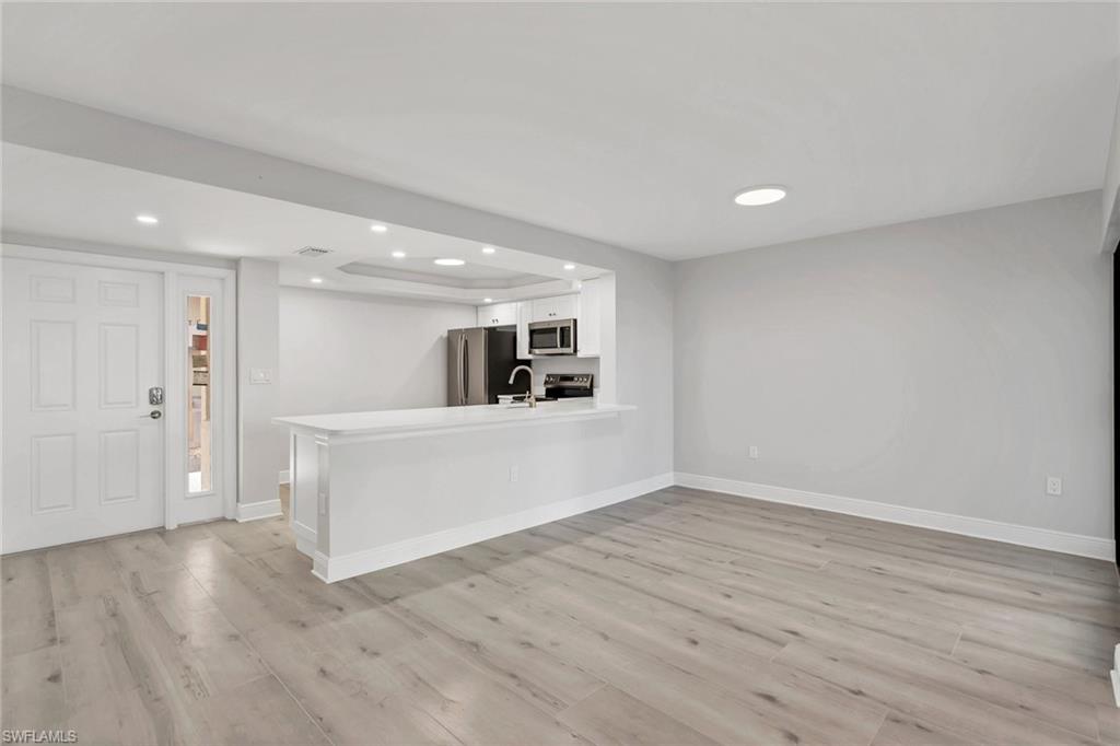 Looking into your dining room and kitchen from Family room