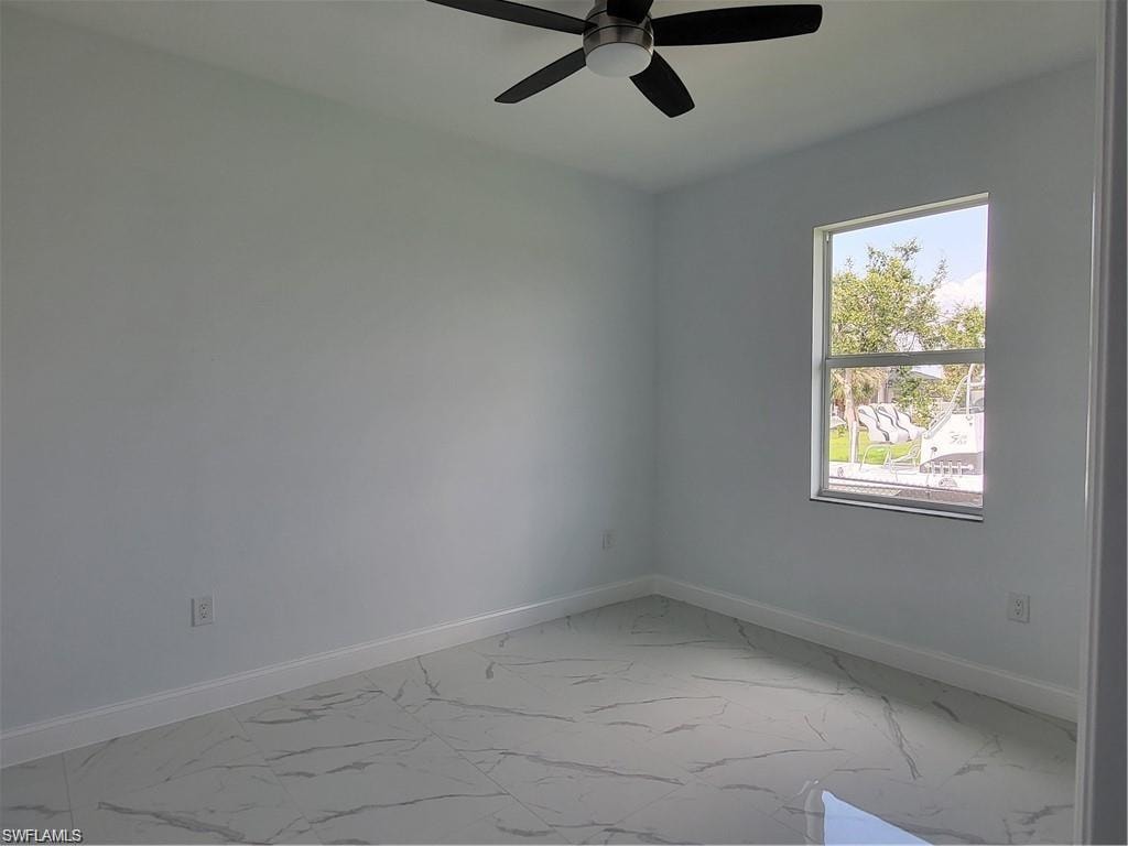 Empty room featuring ceiling fan