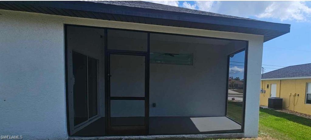 Property entrance featuring central AC