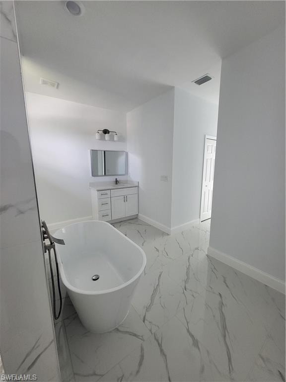 Bathroom featuring vanity and a bathtub