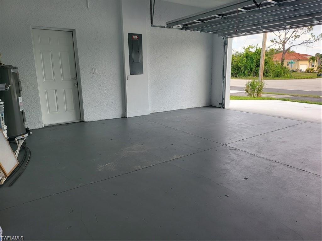 Garage with electric panel and electric water heater