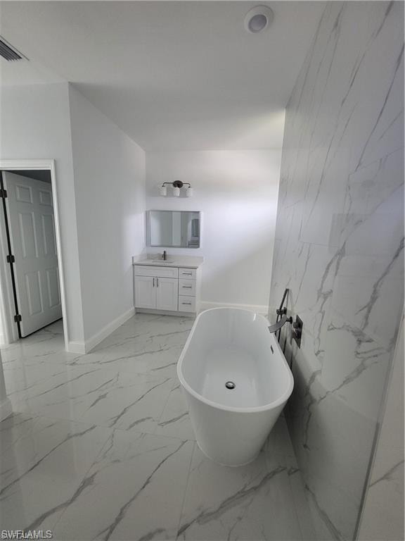 Bathroom featuring vanity and a bathtub