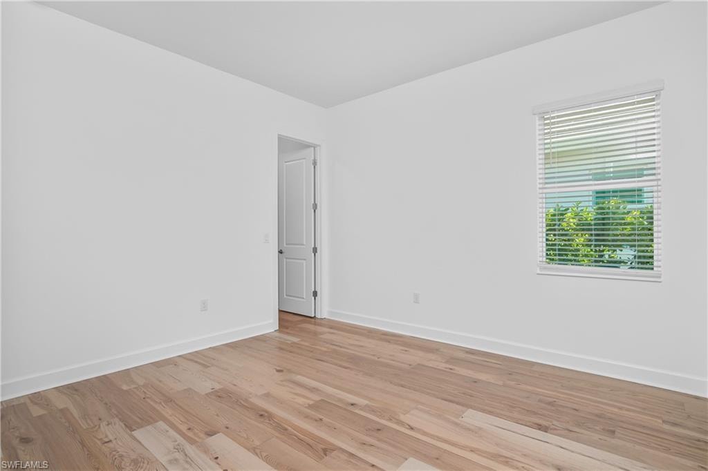 Empty room featuring light wood-type flooring