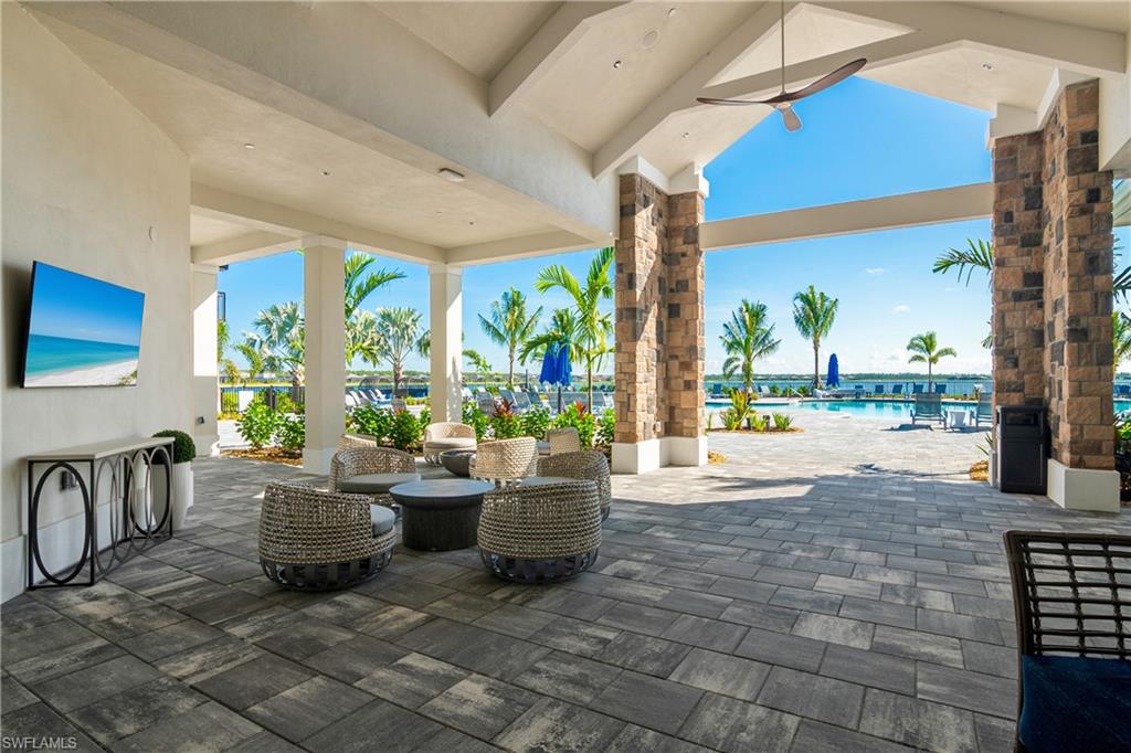 View of patio featuring a community pool