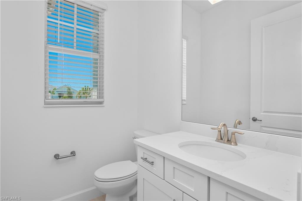 Bathroom with vanity and toilet