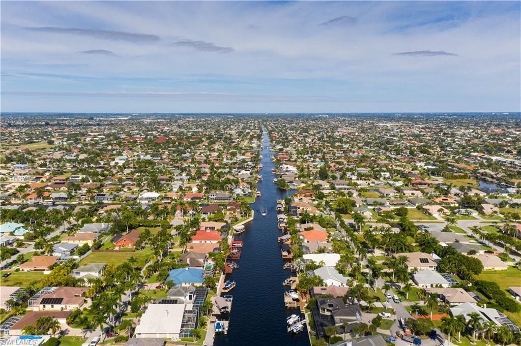 Birds eye view of property featuring a residential view and a water view