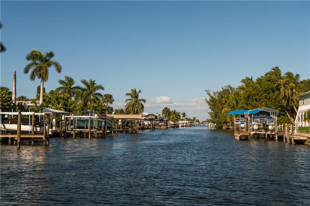 Dock area with a water view and boat lift