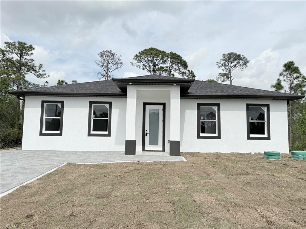 View of front of property with a front lawn