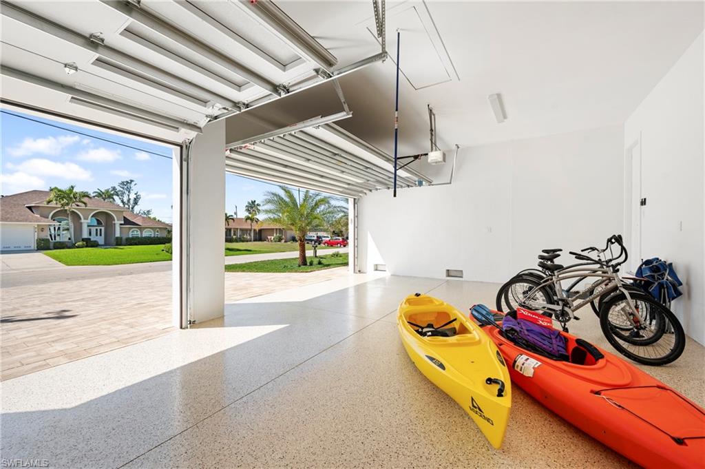 Garage featuring a garage door opener