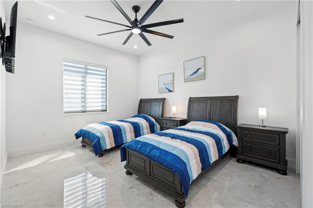 Bedroom with recessed lighting, baseboards, and a ceiling fan