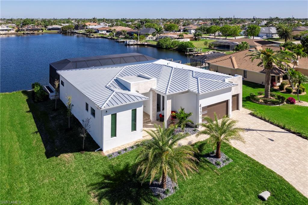 Aerial view with a residential view and a water view