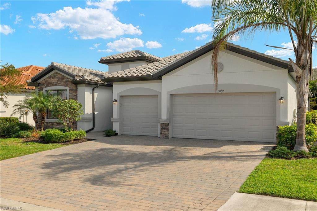 View of front of property featuring a garage