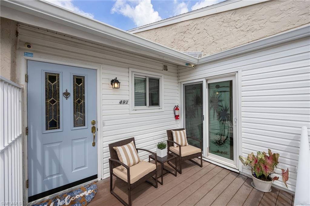 Front door on deck sliders to guest bedroom