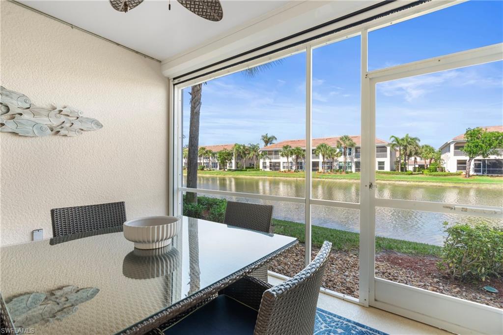 Lanai/Sunroom with a water view