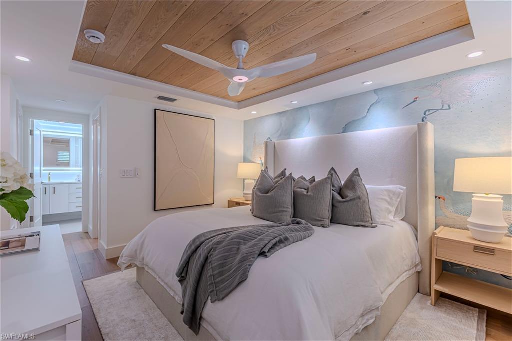 Bedroom featuring recessed lighting, a raised ceiling, wooden ceiling, and light wood finished floors