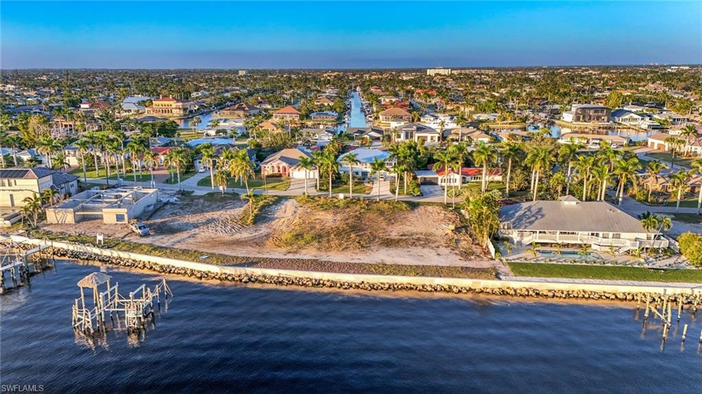 Aerial view with a water view and a residential view