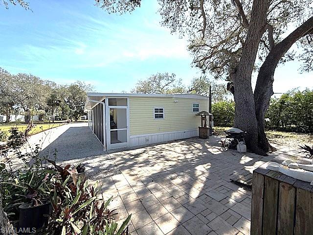 Rear view of property featuring a patio area