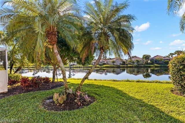 View of yard with a water view