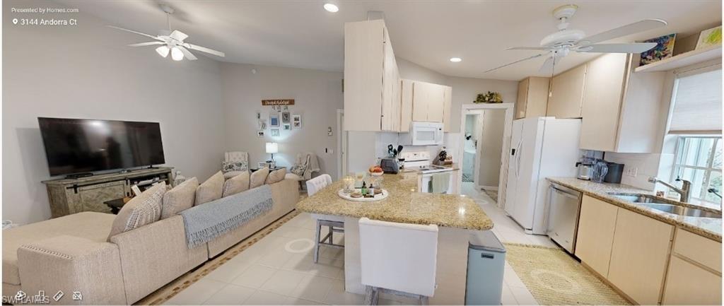 Full bath with toilet, vanity, and visible vents